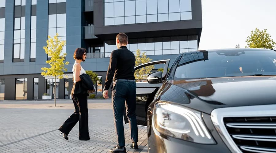 Luxury black car service with professional chauffeur in Texas